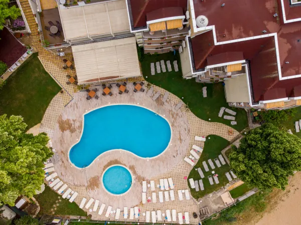 aerial-view-of-swimming-pool-with-sunbeds-at-hotel-2025-03-13-04-56-44-utc-69159a4f26b03